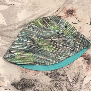 reversible dinosaur and blue swim bucket hat